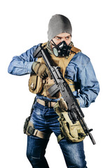 Isolated photo of urban soldier in tactical military outfit and gas mask standing with rifle and gas mask white background.