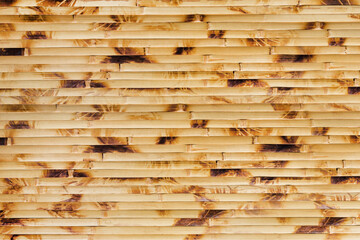 Close up photo texture pattern of wooden colored japanese bamboo mat.