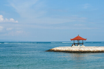 Bali Island, Indonesia - April, 2010. Red traditional pagoda near water. High quality photo