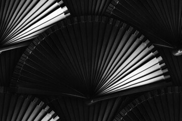 Seamless photo texture pattern of japanese wooden black colored folding fan with no painting on...