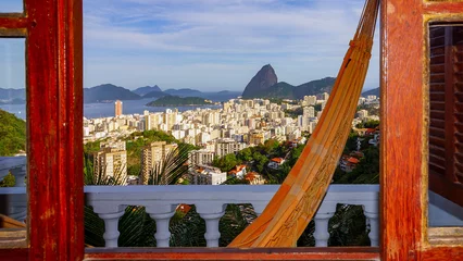 Foto auf Acrylglas Hammock on balcony in front of view on Rio de Janeiro © Photo_and_Pixel