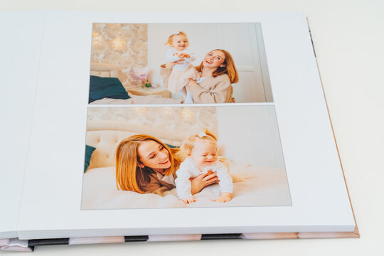a Photobook of family at home on a white background. page with mom and daughter