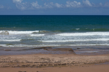 view from the sand from the beach to the sea on a sunny day
