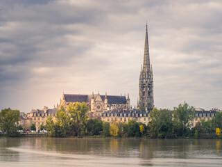 St. Michel cathedral with its bell tower on the Garonne river in Bordeaux, France.