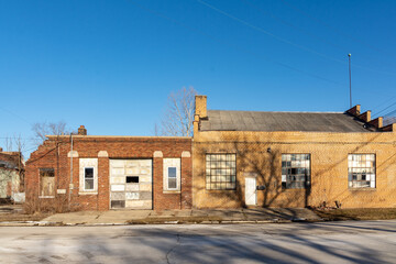 Fototapeta na wymiar Old abandoned industrial building in the bright winter sun. LaSalle, Illinois, USA.