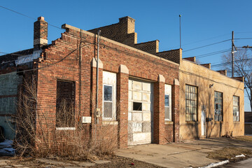 Old abandoned industrial building in the bright winter sun.  LaSalle, Illinois, USA.