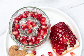 Healthy breakfast, overnight oatmeal with chia seeds and pomegranate