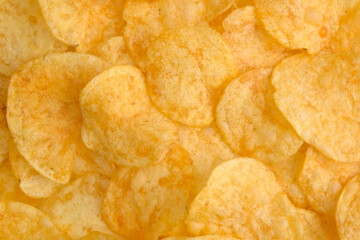 Background of Potato chips close up. Nutrition concept. Top view, copy space. 