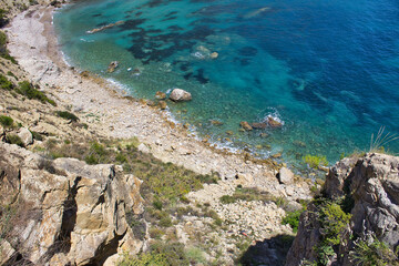 Beach day in the paradise. Aerial views over the cliffs of Raco del Corb in Mascarat, Altea, Spain