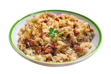 Plate of risotto food with lean pork on curry spice. White plate with food in isolated white setting. Risotto with herb.