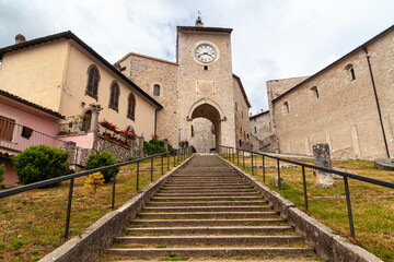 Fototapeta na wymiar The tower with the clock at the top of the steps in Monteleone di Spoleto, Umbria