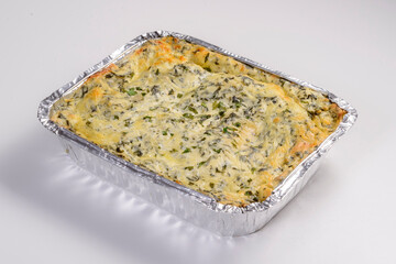 Lasagna delivery. Cod lasagna in packaging for delivery isolated on white background.