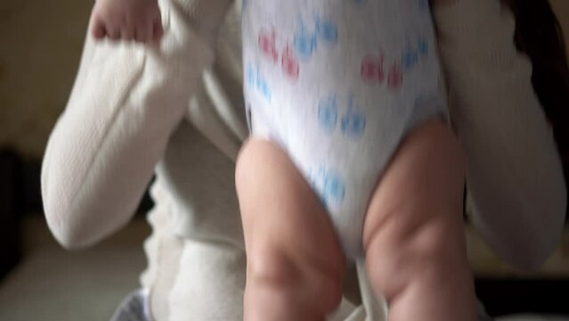 Newborn Active Baby With Young Mom. Cute Smiling Teethless Face Portrait Early Days On Stomach Developing Neck Control. Mother Kissing With Child Look At Camera. Infant, Childbirth, Beginning Concept