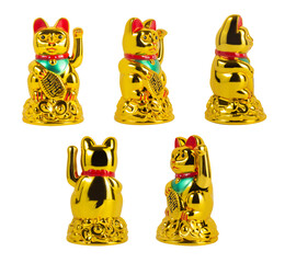 Isolated photo of golden colored japanese Maneki neko cat talisman on white background.