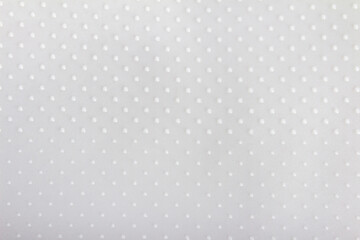 Close up texture of gray colored dotted rubber texture.