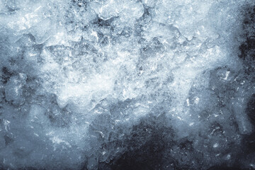 Photo of silver toned frozen ice surface texture.