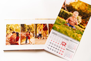 Naklejka na ściany i meble calendar for 2022 with a photo of boy and photobook from a family photo shoot. 
