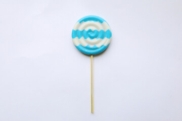 chocolate candy on a stick with a beautiful multicolored glaze 