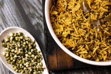SPROUT RICE INSIDE WHITE SERVING BOWL WITH BLACK BACKGROUND