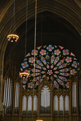Wonderful pipe organs and colorful stained glass. Interior Votive Church, Votivkirche, neo-Gothic...