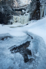 Fototapeta na wymiar Delicate ice formations at a frozen Elakala Falls in Blackwater Falls State Park in West Virginia.
