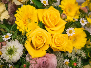 close-up yellow cute flower bucket including roses