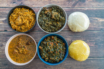 Egusi Ogbonno, Vegetable and Afang soup with pounded yam and Eba Garri