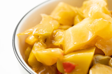 Pickled mustard greens on a monochrome background