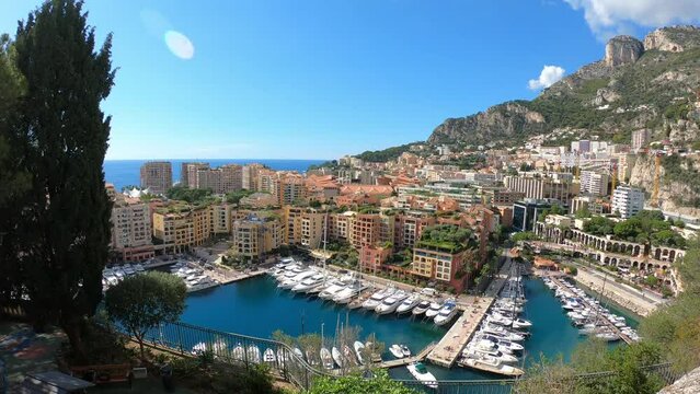 PAN SLOW MOTION SHOT - Port Fontvieille is also known as Port of Fontvieille or Le Port de Fontvileille and it is situated in Monaco, which is situated on the Cote d'Azur, on the French Riviera.