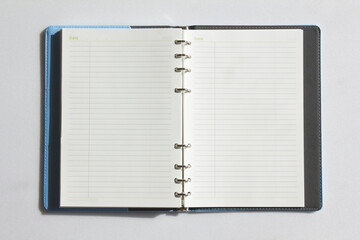Open diary, planner or notebook. Office and business supplies for lists, reminders, schedules or agendas.