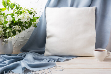 Pillow mockup with apple blossom branches and blue scarf