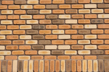 Fototapeta na wymiar House wall made of dark red brick
