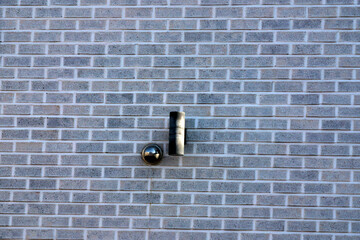 Dark gray bricks installed on the wall of a house