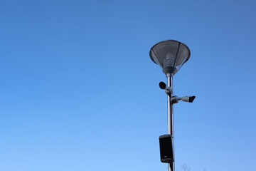 Fototapeta na wymiar Mercury street lamp on cloudy sunny weather background