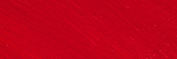 bright red background: thick acrylic paint unevenly on a flat surface