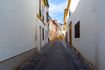 Cordoba streets on a sunny day in historic city center near Mezquita Cathedral.