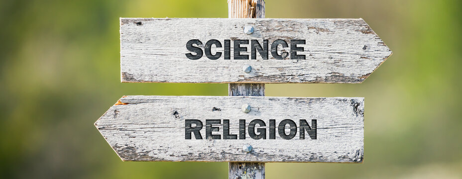 opposite signs on wooden signpost with the text quote science religion engraved. Web banner format.