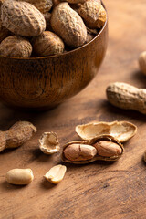 A Bowl of In Shell Peanut on a Wooden Table