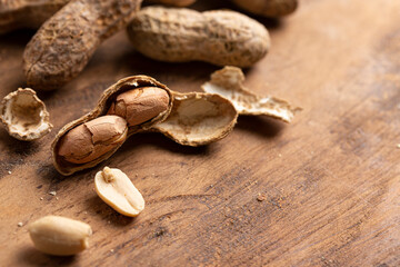 A Bowl of In Shell Peanut on a Wooden Table