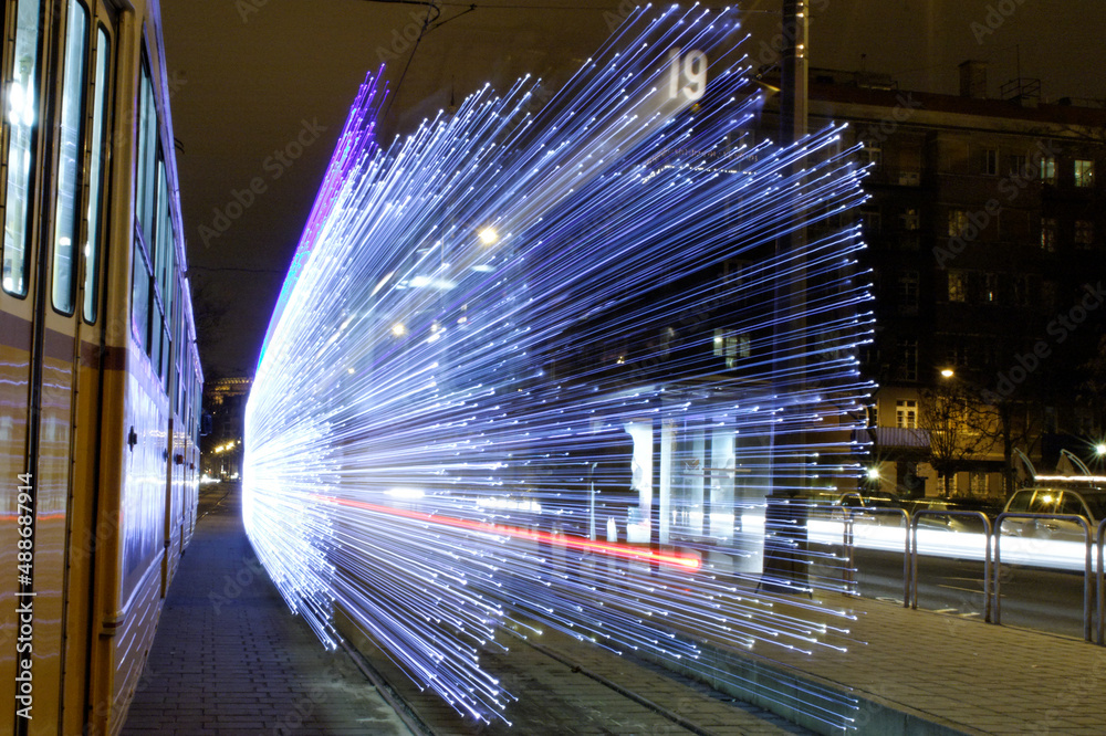 Poster long exposure of christmas tram lights in budapest, hungary at night