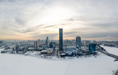 Yekaterinburg aerial panoramic view in Winter at sunset. Yekaterinburg city and pond in winter.