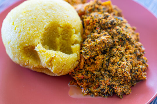 Nigerian Egusi Melon soup with garri eba for lunch