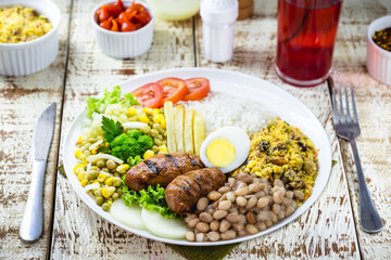 roasted and grilled sausage typical of brazil, smoked pork, served hot with rice and beans, tomato, salad and fries. Typical Minas Gerais food