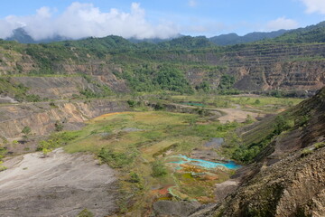 The landscape of Panguna mine copper and gold pit in the Autonomous Region of Bougainville, Papua New Guinea - obrazy, fototapety, plakaty