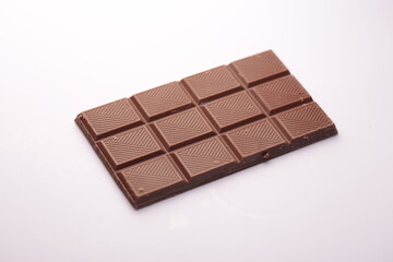 Milk chocolate bar on white background