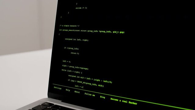 Developer is browsing html code on the computer screen. Scroll of HTML Web Page Code. Programming code abstract technology background. Computer script concept. High quality 4k footage