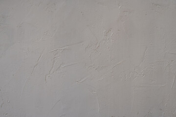 The texture of a gray concrete wall, the background for the design.