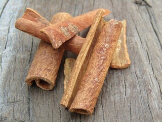 cinnamon sticks on a wooden background