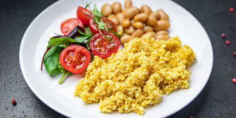couscous with beans and salad tomato vegetables fresh portion healthy meal food diet snack on the table copy space food background rustic keto or paleo diet veggie vegan or vegetarian food no meat