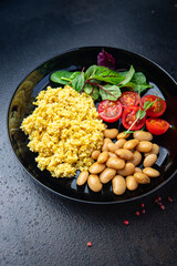 couscous with beans and salad tomato vegetables fresh portion healthy meal food diet snack on the table copy space food background rustic keto or paleo diet veggie vegan or vegetarian food no meat